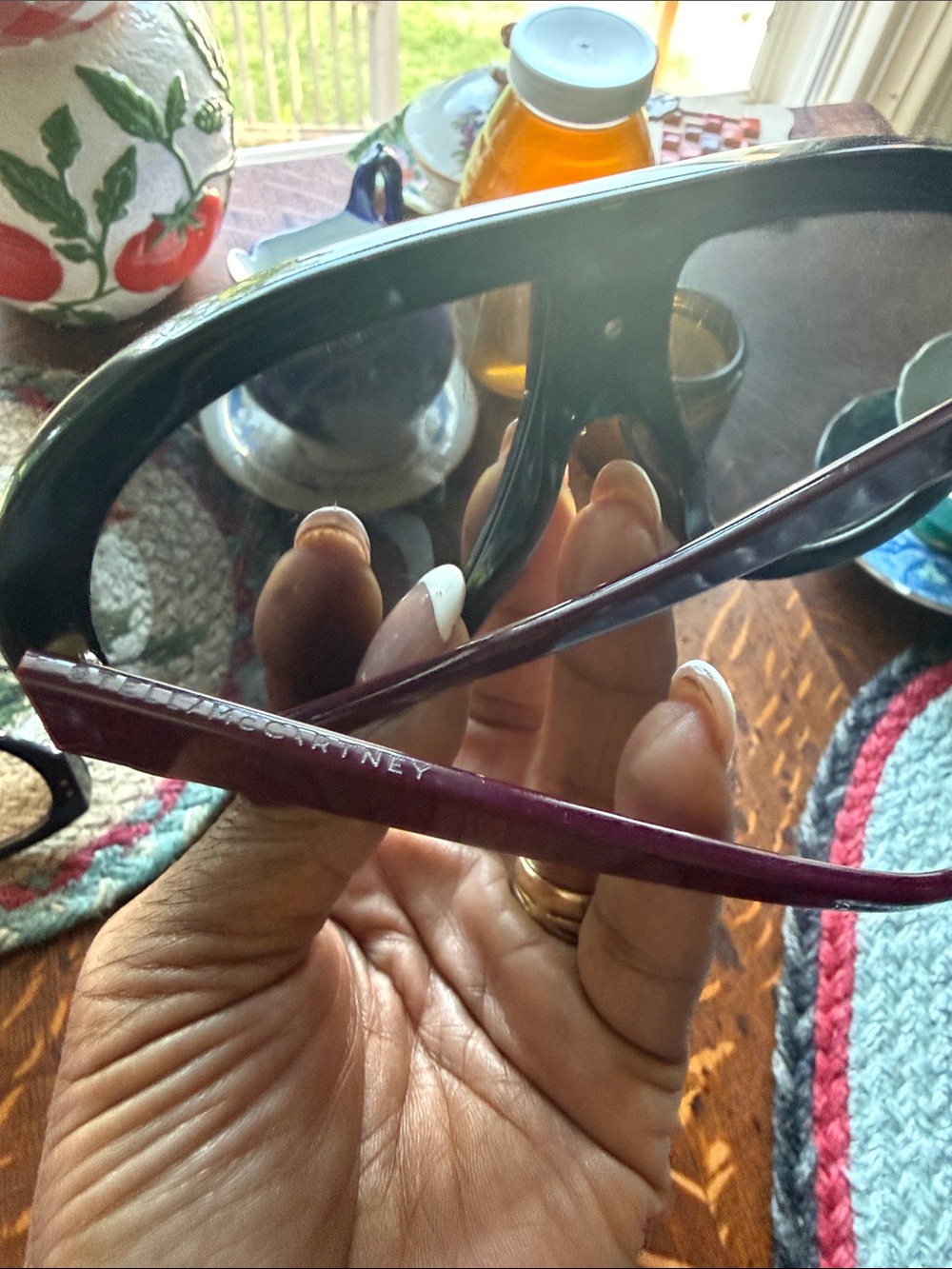 Stella McCartney Burgundy Sunglasses.  There is a hairline Scratch.